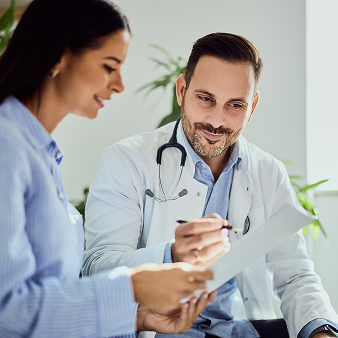 doctor explaning to paitent weared blueshirt